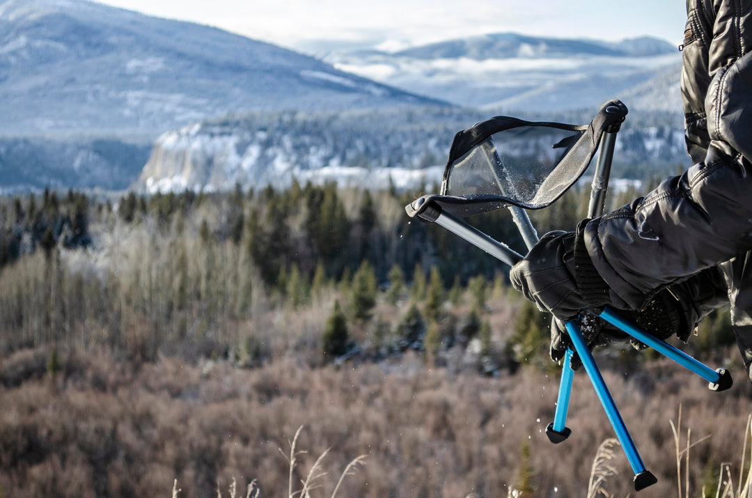 BTR Stool in snow while strapping on some snowboard boots